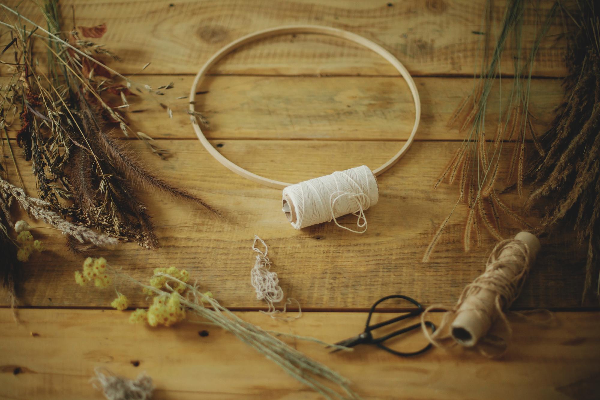 atelier workbench with threads and hoop