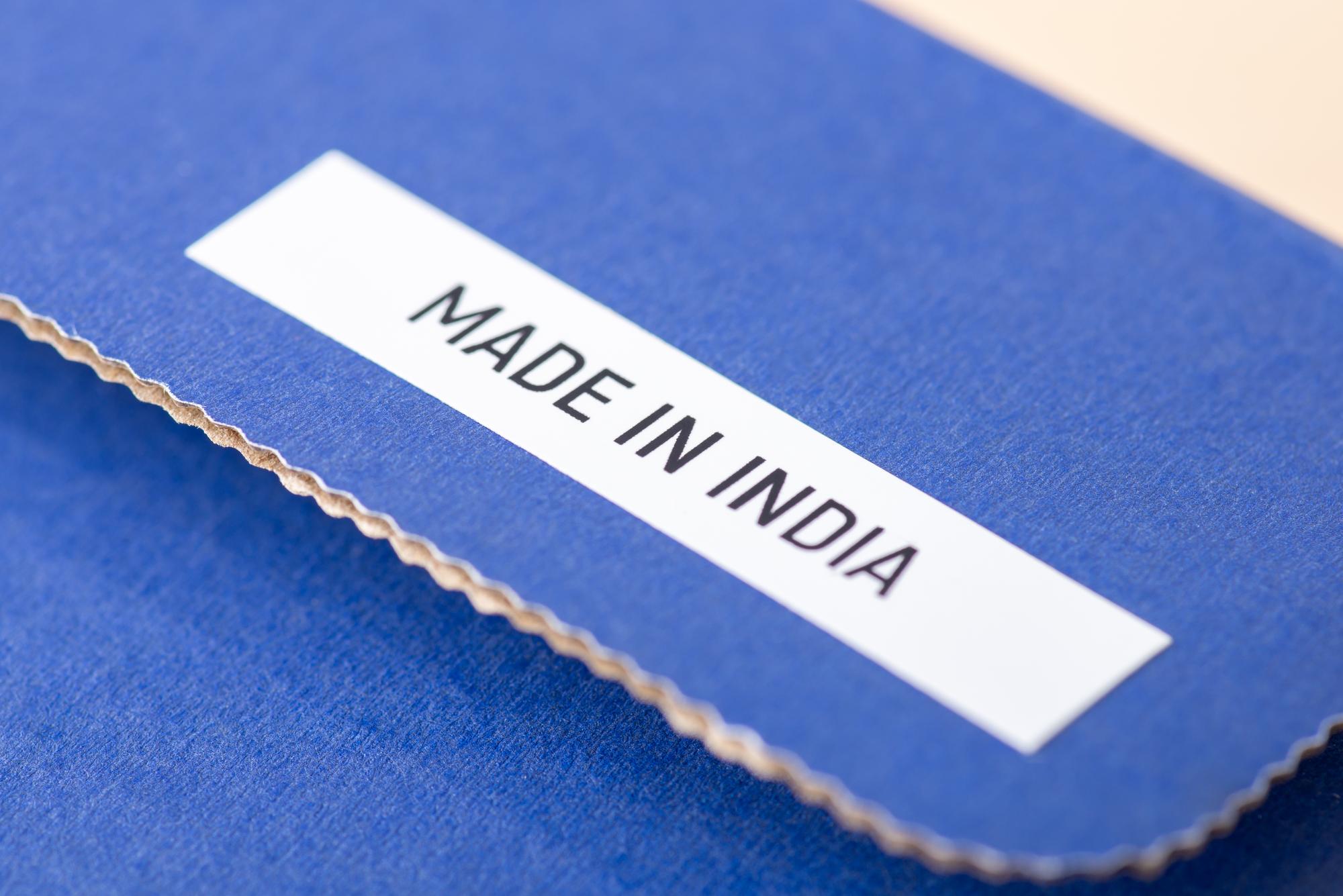 stack of embroidered labels and samples